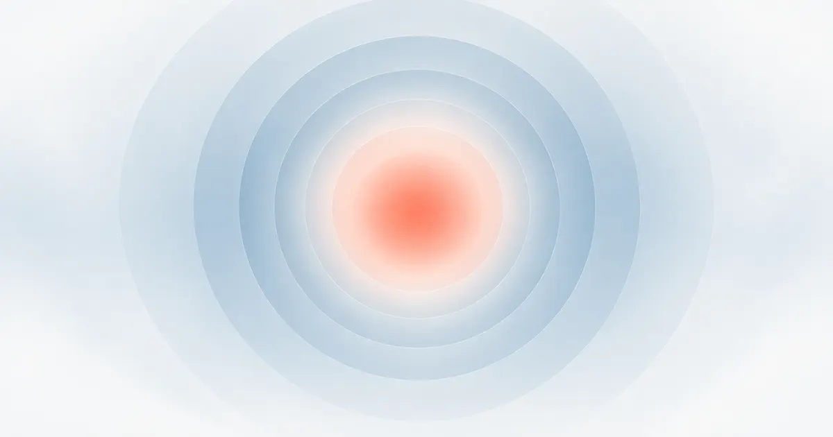 A coral glow at the centre surrounded by cool blue-grey rings